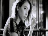 20%, circle in the center, black and white, woman, in the city, color change, eyes, looking at camera, 100%, goods, holding in hand, black back logo